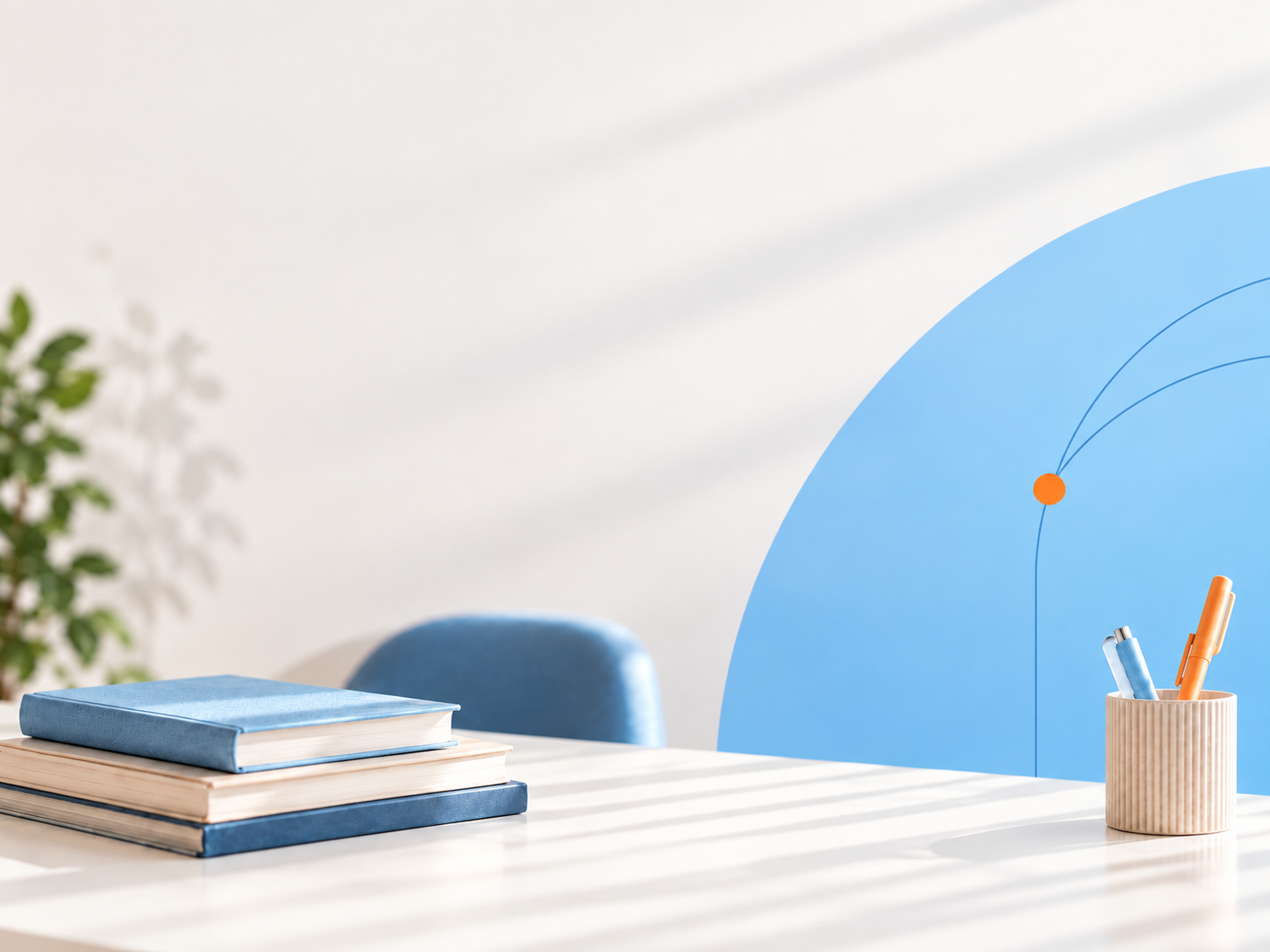 Secretária com livros e canetas e o arco azul do NeuroGime Academy